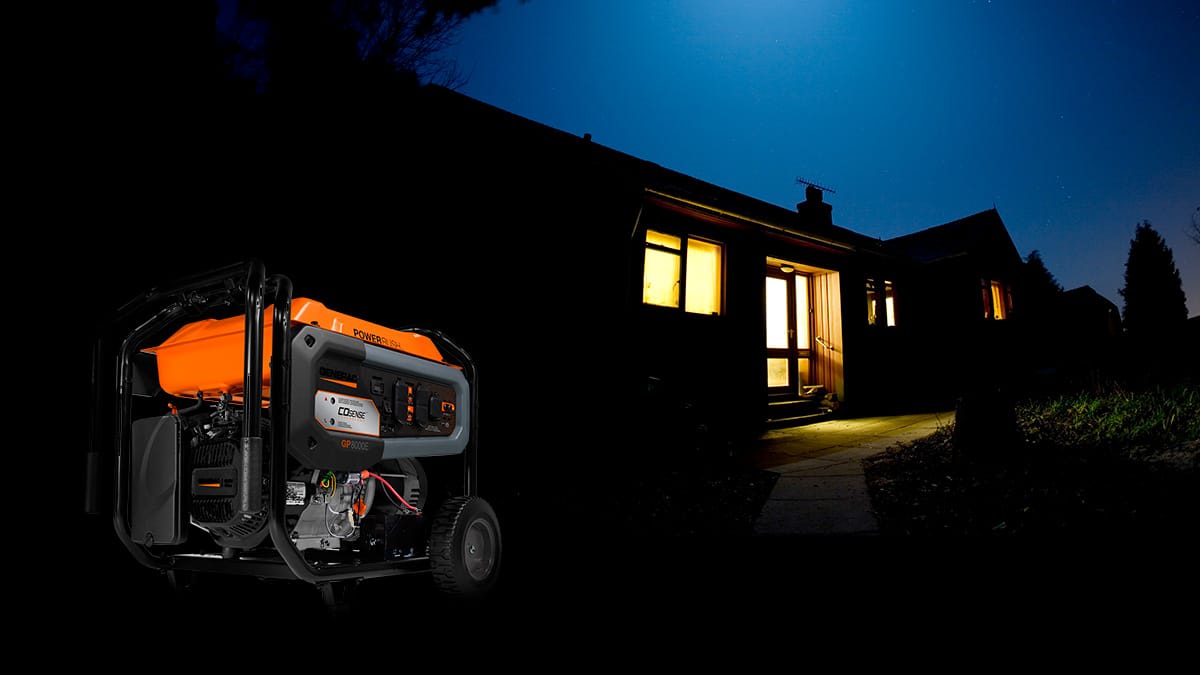Portable generator powering home at night during outage