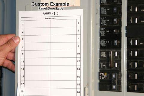 Breaker panel door open showing panel label and breakers