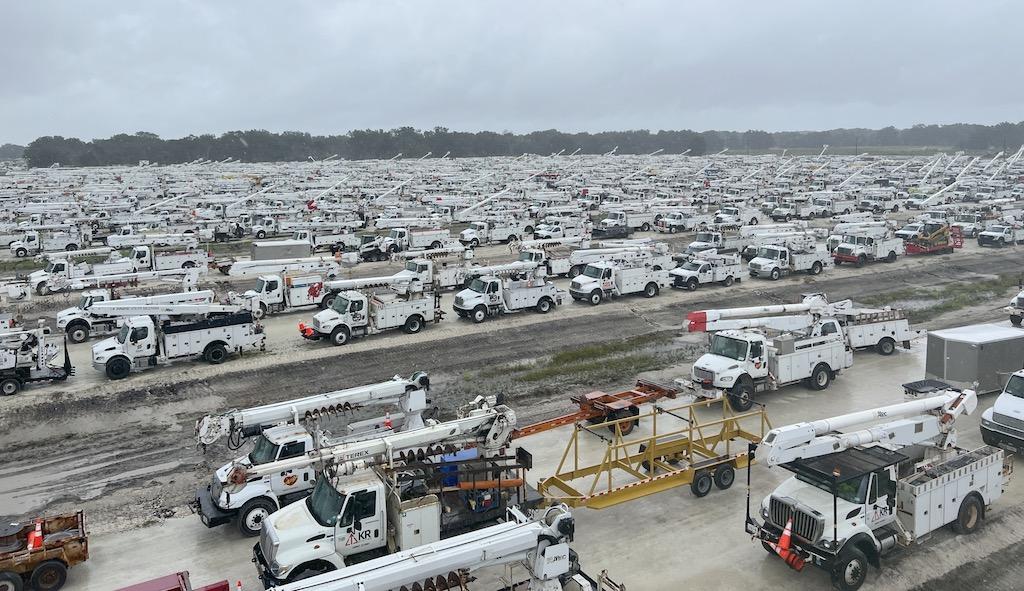 Storm restoration lineman crews and utility trucks