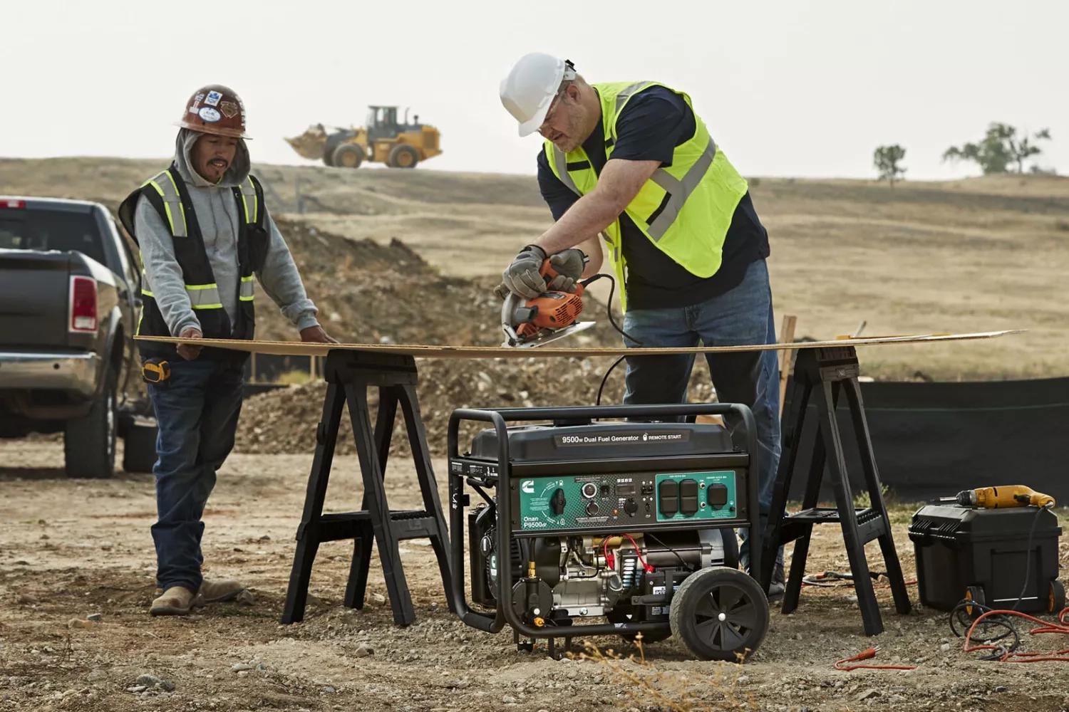 Portable generator powering construction tools and charging batteries